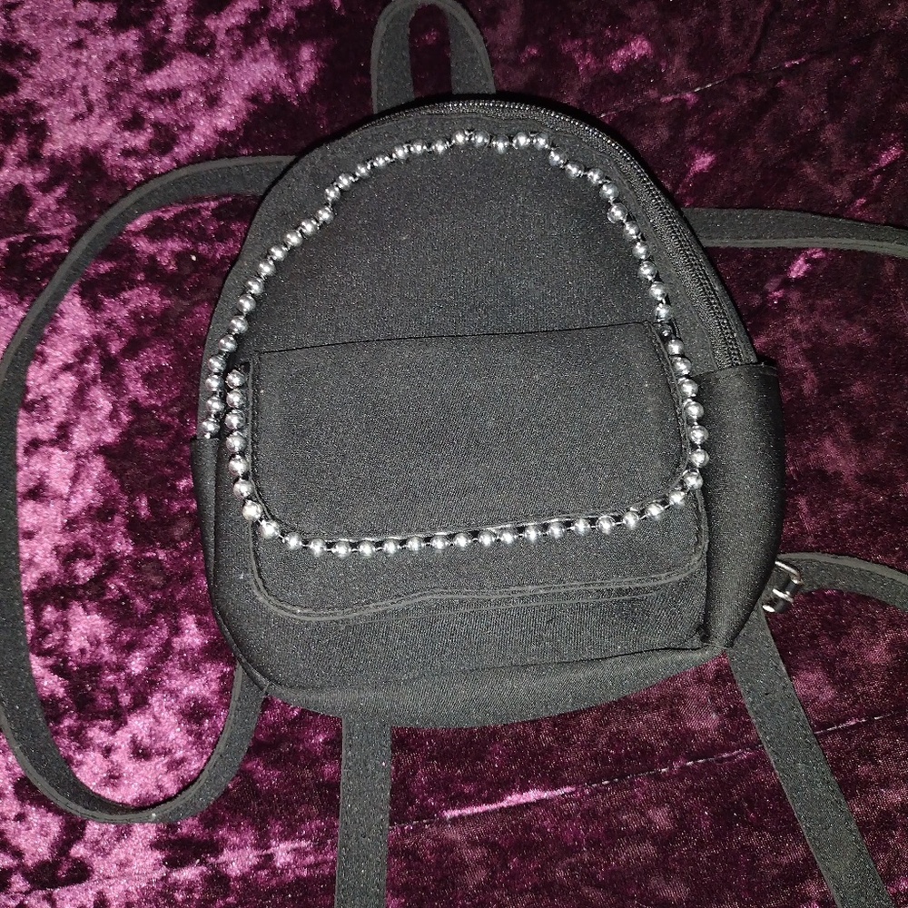 A black mini purse/Backpack with pearls